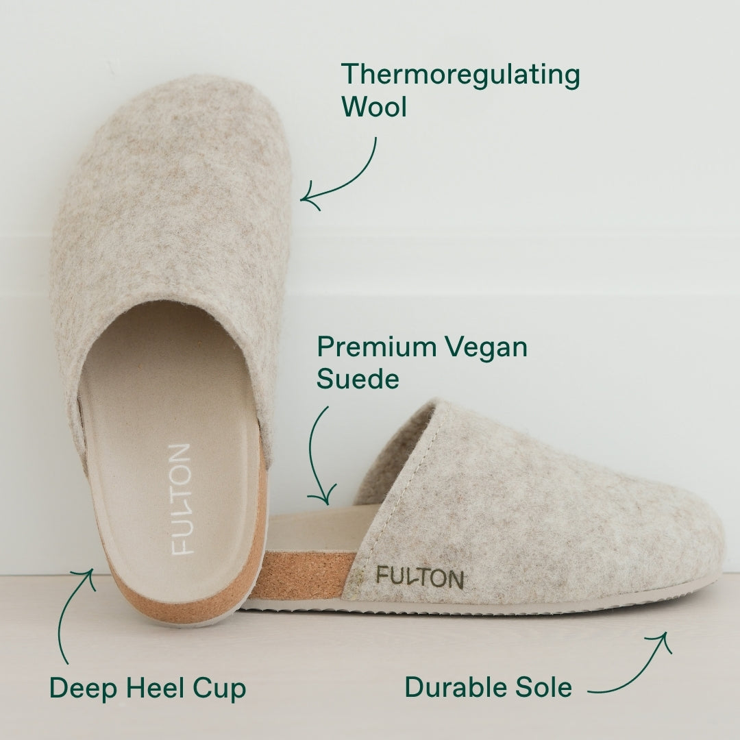 Beige house shoe showing plush wool upper and tan durable sole