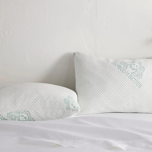 Adjustable cooling pillow with white cover and mint patterned trim for neck support