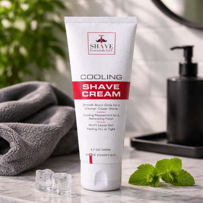 Cooling shave cream tube standing on a counter, white with red label