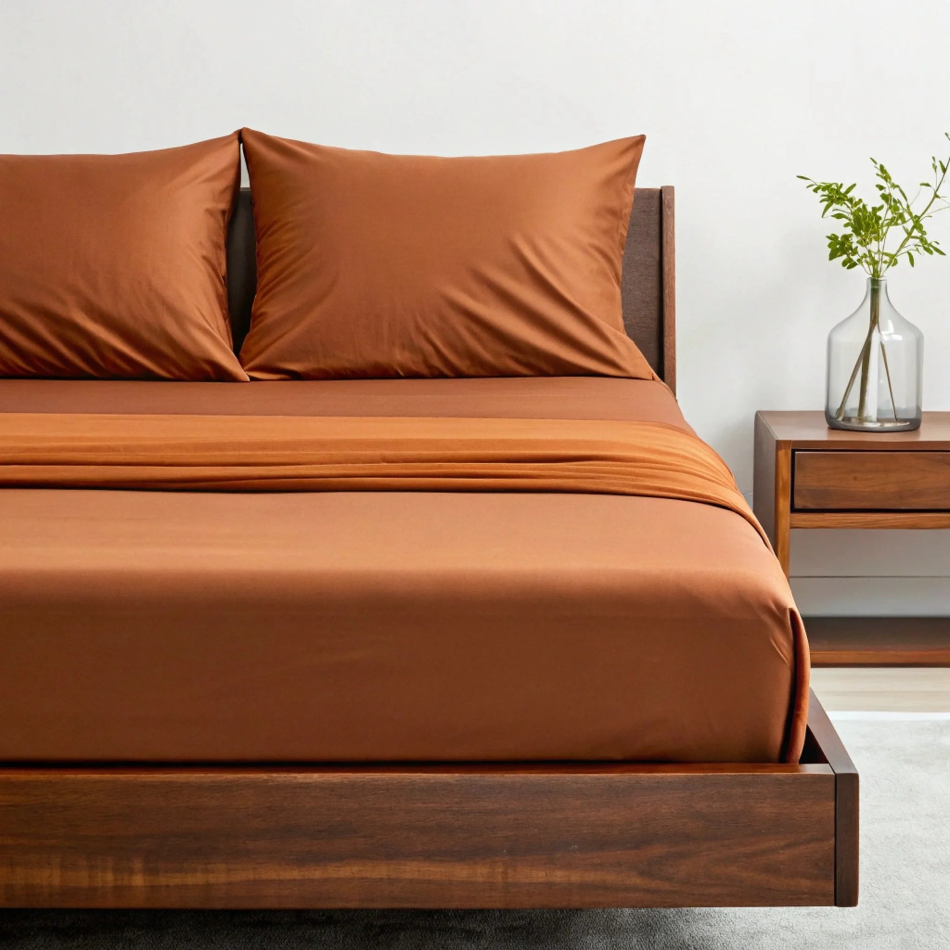Copper-infused bamboo sheet set in rust brown, close-up of sheet and pillow