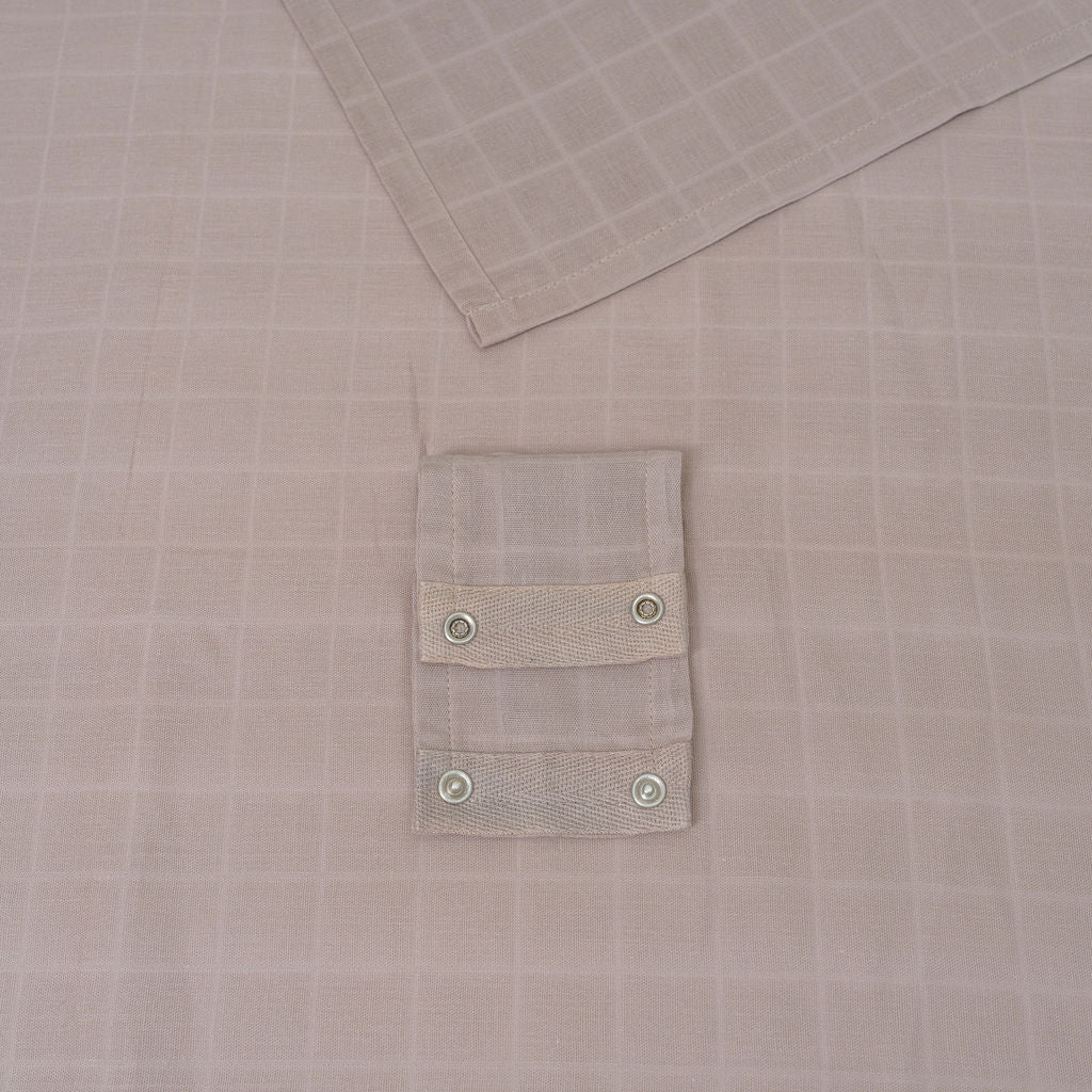 White muslin car seat cover with snap-button pocket panel detail