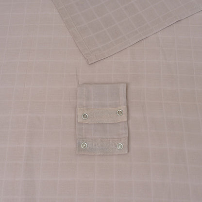 White muslin car seat cover with snap-button pocket panel detail