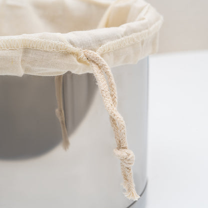 Nut milk bag drawstring and seam detail, off-white mesh pouch