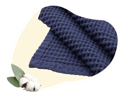 Navy waffle weave throw blanket with textured fabric, folded lengthwise.