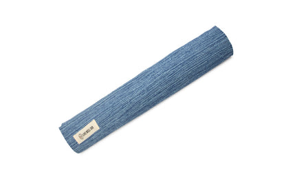 Organic cotton yoga mat, blue rolled up with fabric label on end.