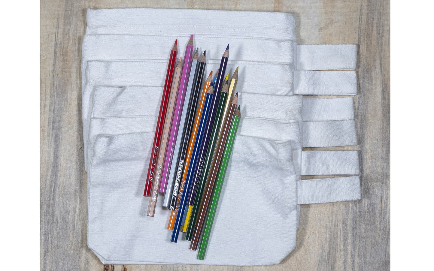 White canvas zipper pouch, shown open with markers inside