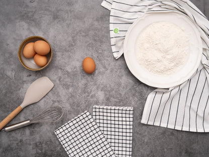 Kitchen towel set: folded check and striped towel pieces in white with black lines