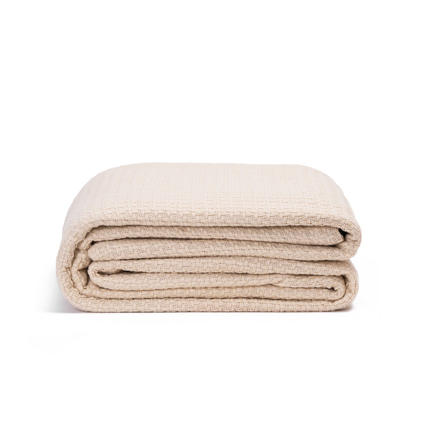 Beige basket-weave blanket neatly rolled with stacked layers