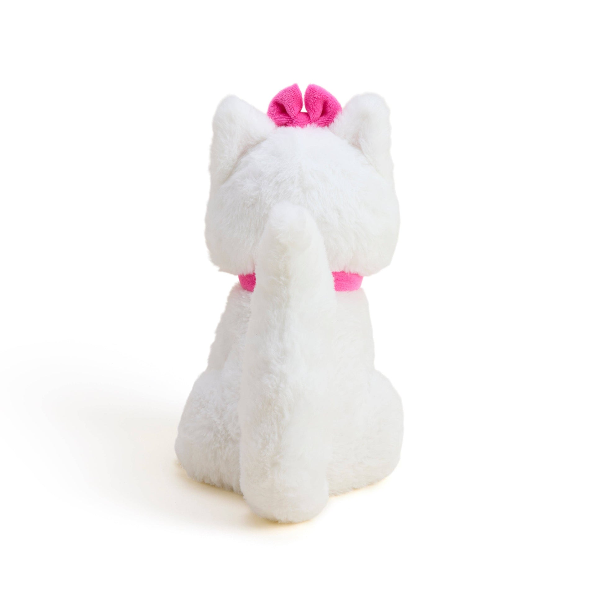 White plush cat with pink bow, standing side view, soft plush texture
