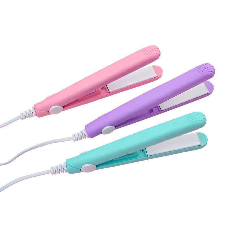 Ceramic mini hair straightener, pink body with flat ceramic plates and power cord