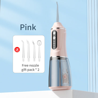 Pink portable electric dental flosser with free nozzle gift pack shown