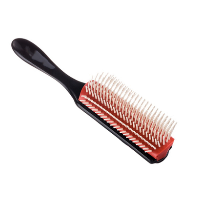 Black massage hair comb with red base and white-tipped bristles