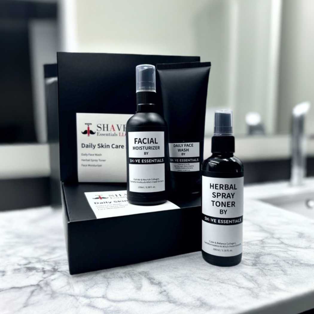 Skincare kit with black box and three facial bottles