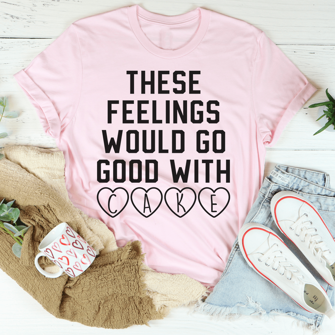 Light pink crew-neck T-shirt with 'THESE FEELINGS WOULD GO GOOD WITH CAKE' lettering