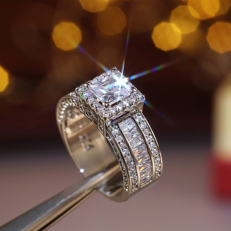 Square-cut halo zircon ring with silver pavé split shank
