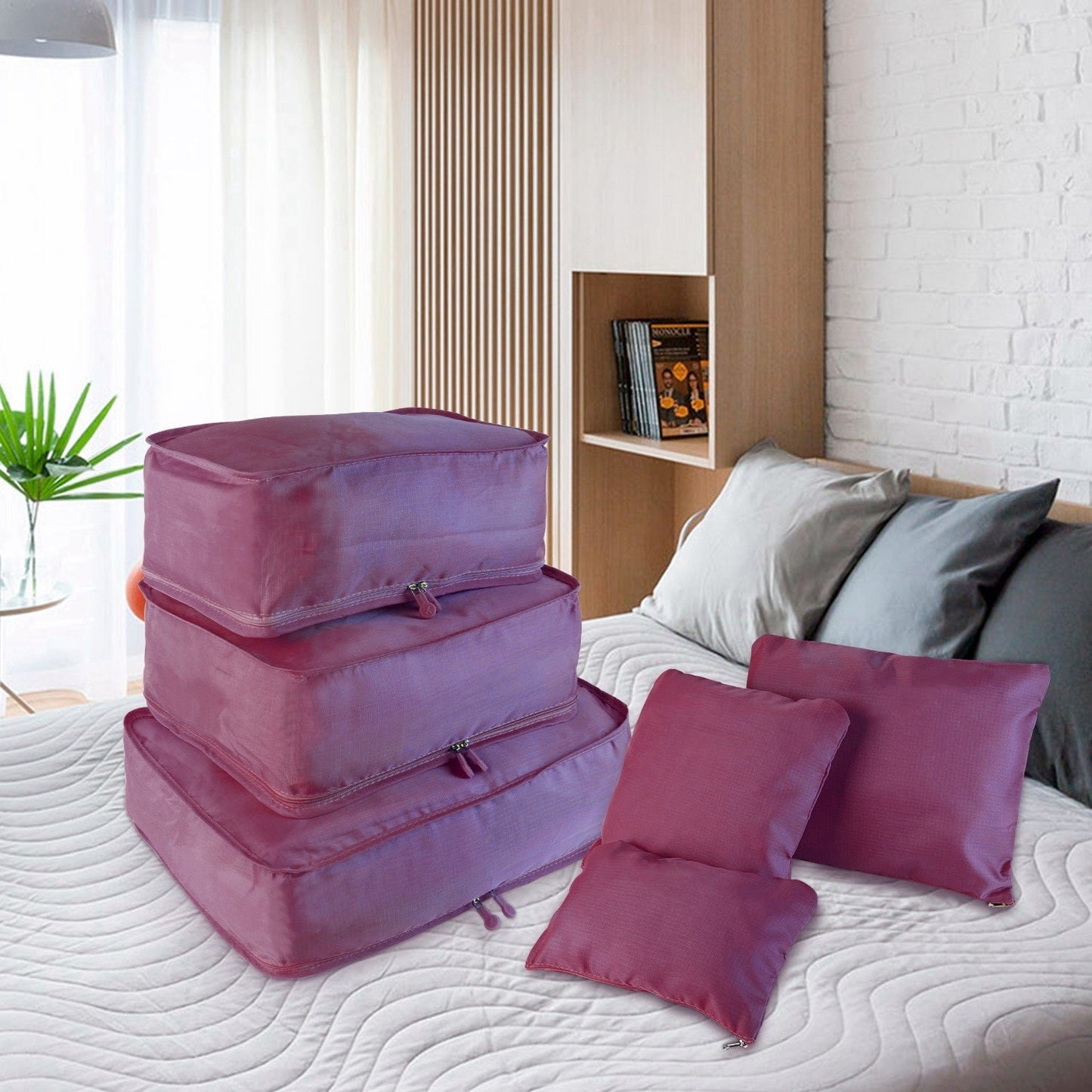 Water-resistant packing cube set in purple and white, including round top organizer and pouches.