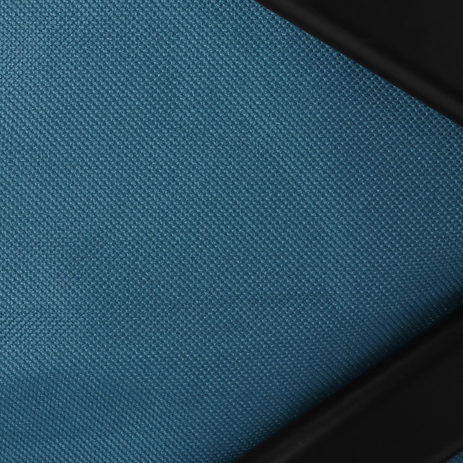 Teal woven fabric panel with black trim for collapsible utility wagon