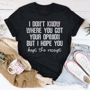 Black T-shirt laid flat with bold slogan text and script "kept the receipt" on front