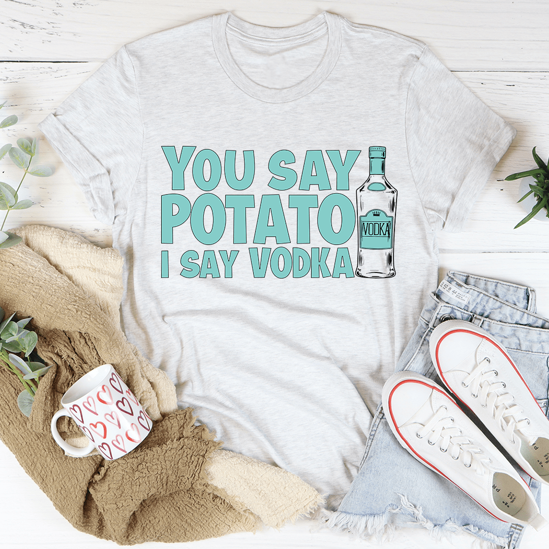 White crew-neck T-shirt with teal 'YOU SAY POTATO I SAY VODKA' graphic