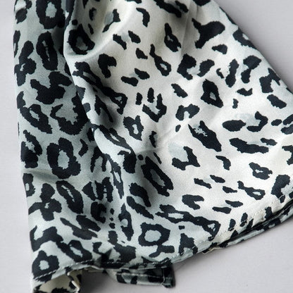 Close-up of black and white leopard print silk scarf fabric