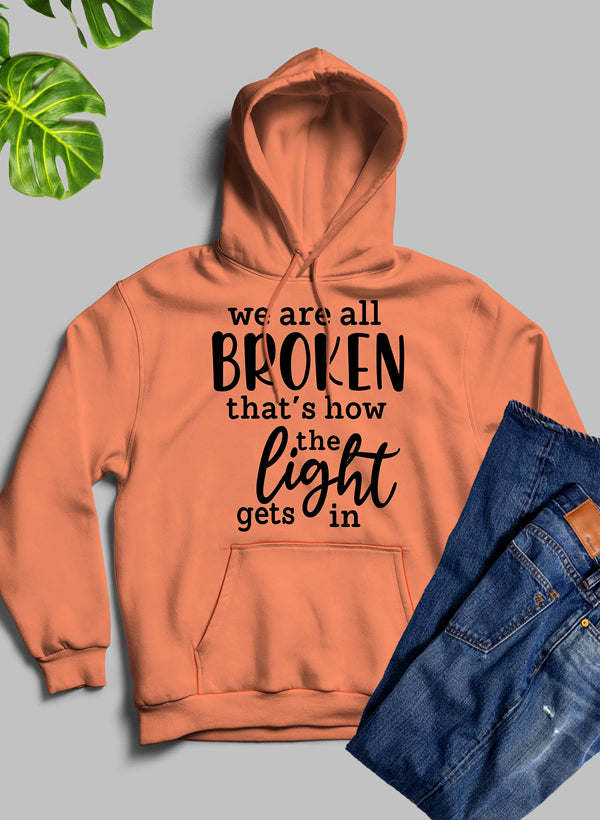 Orange pullover hoodie with hood and kangaroo pocket; front text graphic