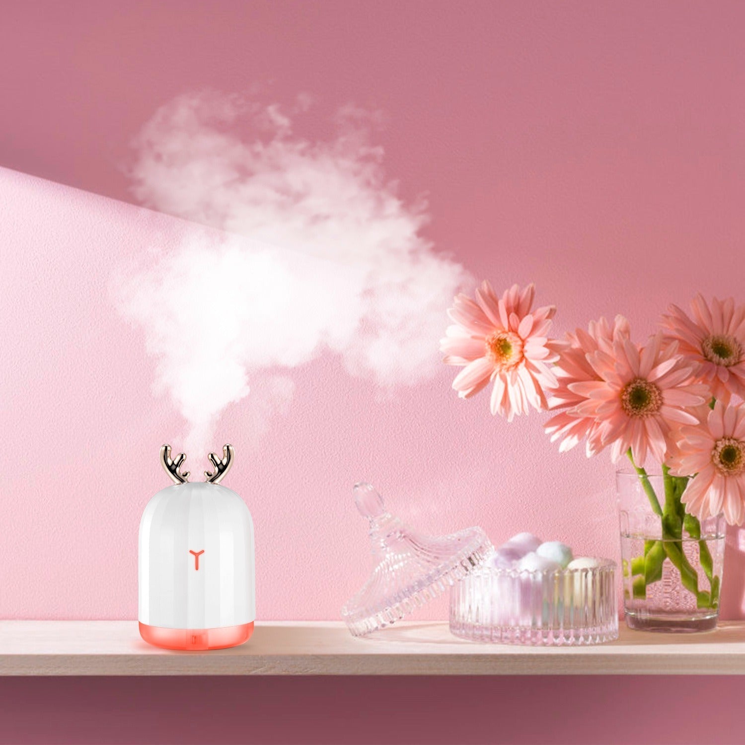 Deer antler cool mist humidifier, white base with warm glow, releasing mist
