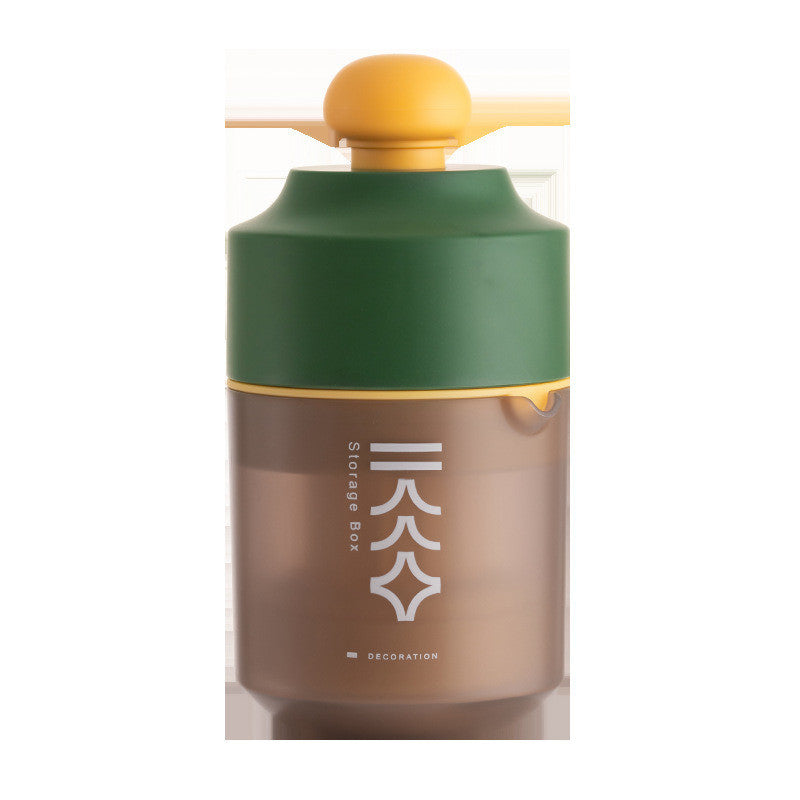 Portable manual citrus juicer with orange squeeze top and green-brown container