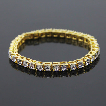 Gold-tone rhinestone link bracelet with clear CZ stones and secure clasp