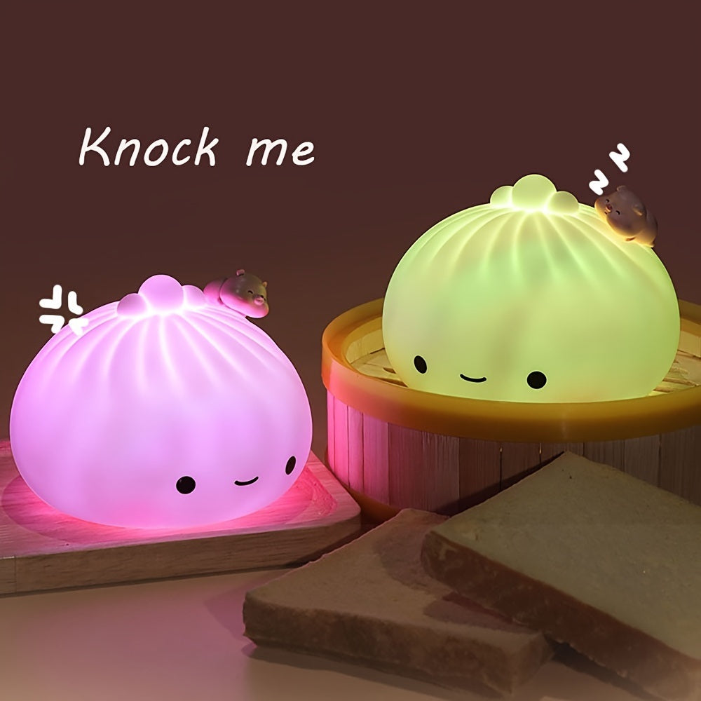 Glowing silicone dumpling night light set with pink and green buns and a round tabletop base