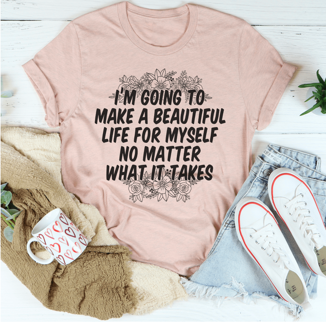 Soft peach T-shirt with bold quote and floral graphic on the front