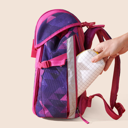 Children's pink backpack back panel with hand lifting a padded insert from the pocket