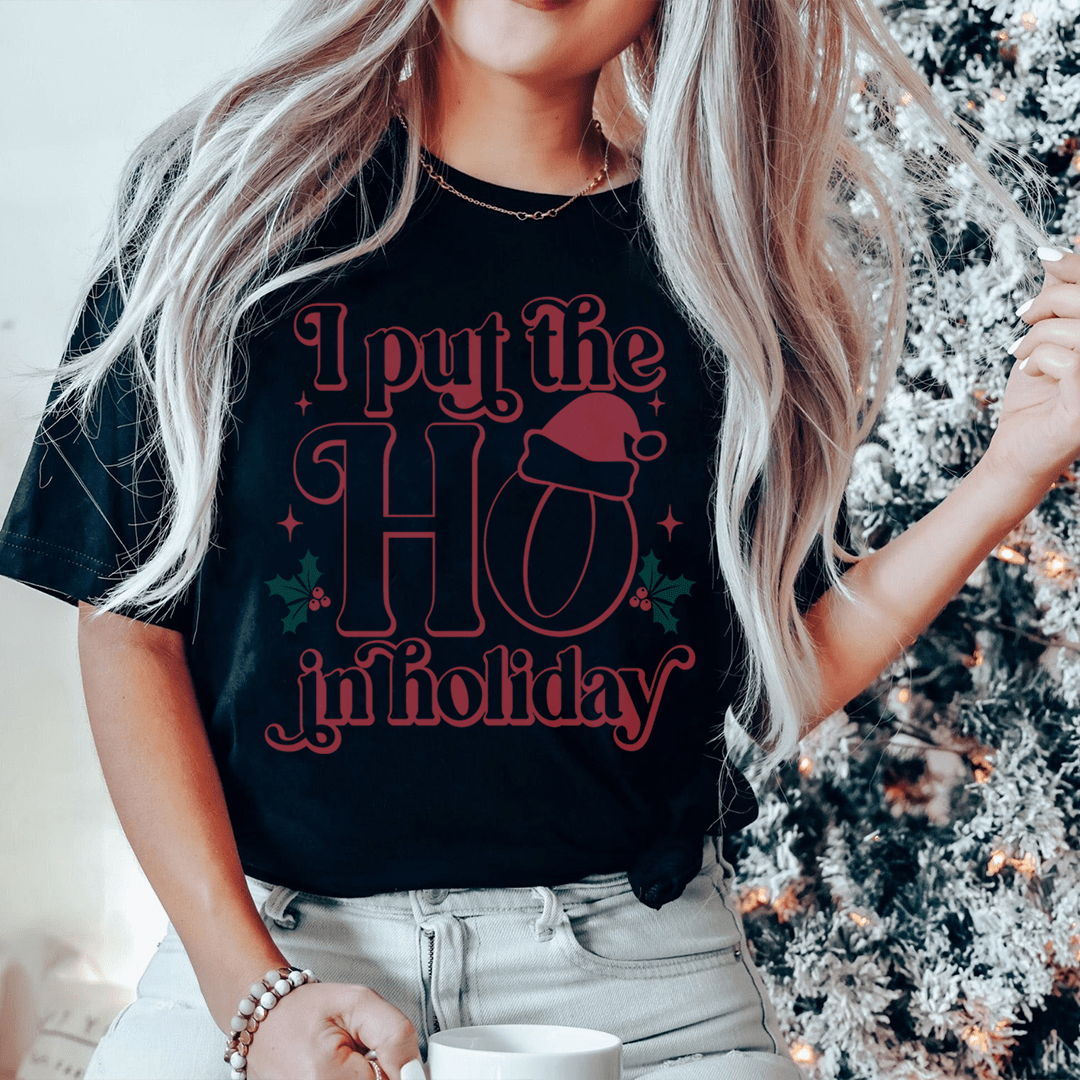 Black crew-neck T-shirt with red “I put the HO in holiday” graphic