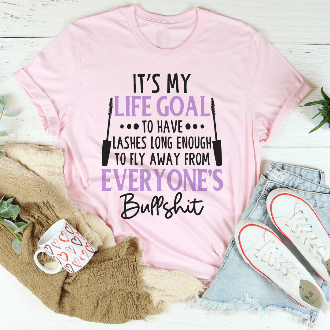 Pink crewneck t-shirt with large “Life Goal” slogan graphic