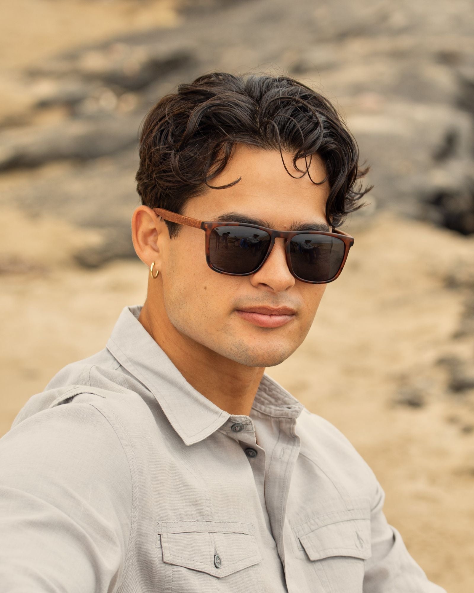 Rectangular brown-framed sunglasses with dark polarized lenses