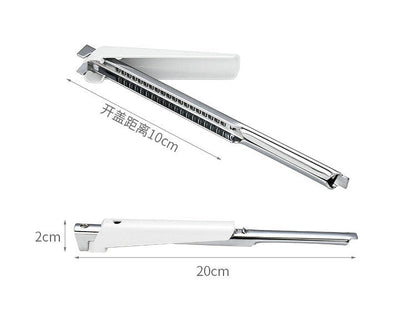 Adjustable jar lid opener with serrated grip and long stainless steel body, white top.