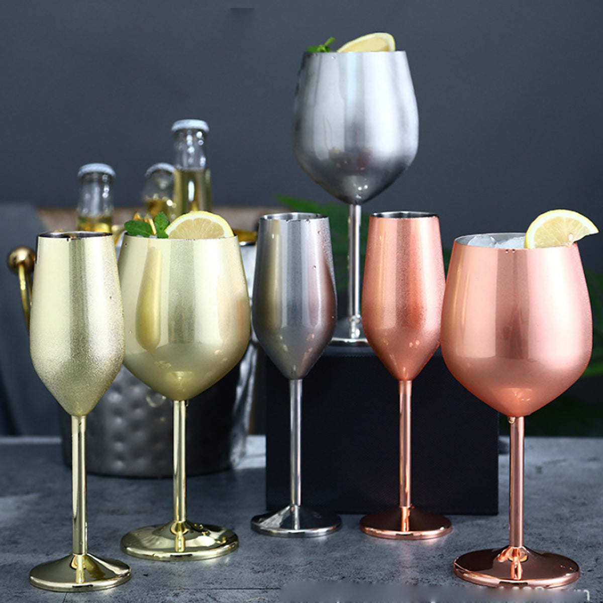 Set of metallic stemmed cocktail glasses in pale gold, silver, green-gold, rose gold, and copper
