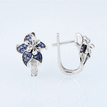 Silver-tone stud earrings with blue double-flower design and vertical clear zircon bar