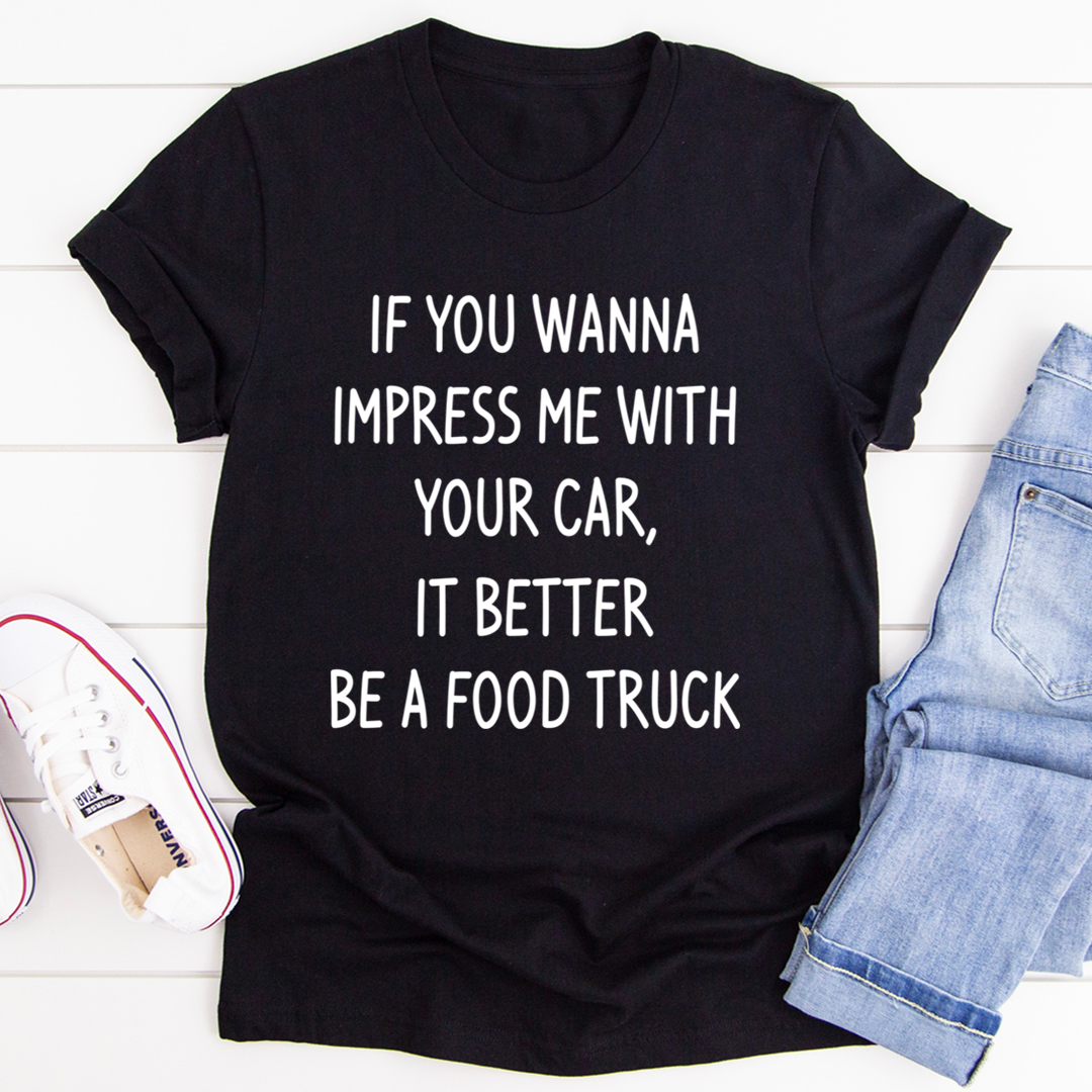 Black crewneck T-shirt with bold white text graphic: BE A FOOD TRUCK