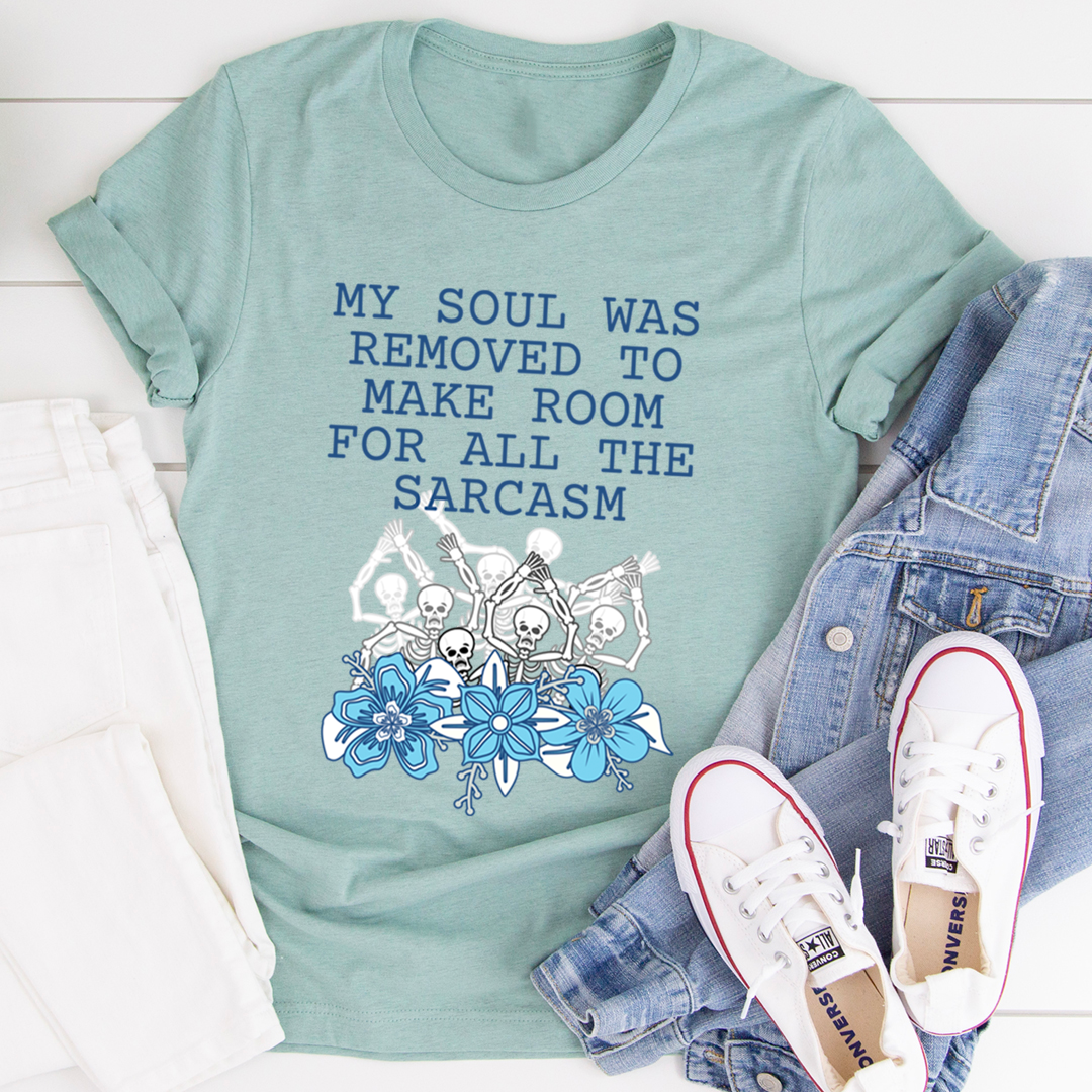 Mint green short-sleeve T-shirt with blue slogan text and skull-and-flower graphic