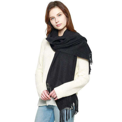 Black pashmina shawl with long fringe, wrapped and draped across the front.