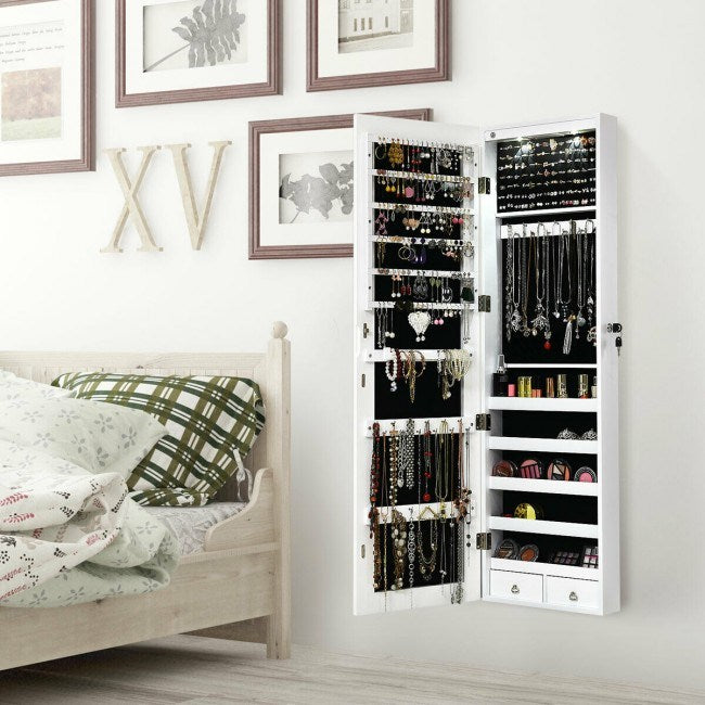 White mirrored jewelry cabinet with open doors and organized necklace and earring displays