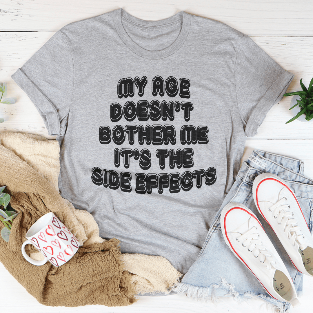 Heather gray crewneck T-shirt with large text graphic reading “MY AGE DOESN'T BOTHER ME”.