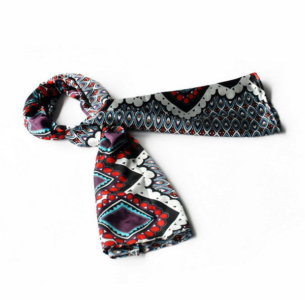 Silky scarf with black, white, red, and purple geometric patterns, small wrap style