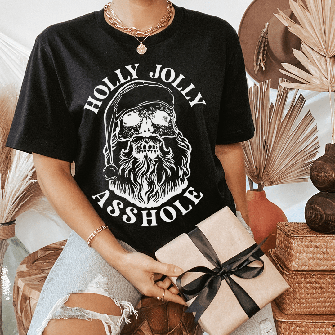 Black graphic T-shirt with bearded Santa face in oval and text Holly Jolly Asshole