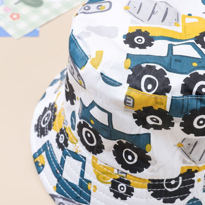 Kids' car-print bucket hat close-up on white fabric, stitched edge and brim panel