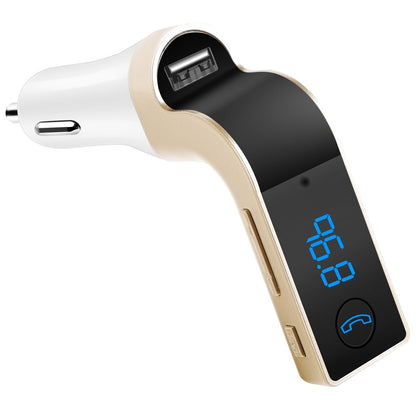 Gold and white car FM transmitter close-up with LCD showing 88.8 and USB port detail