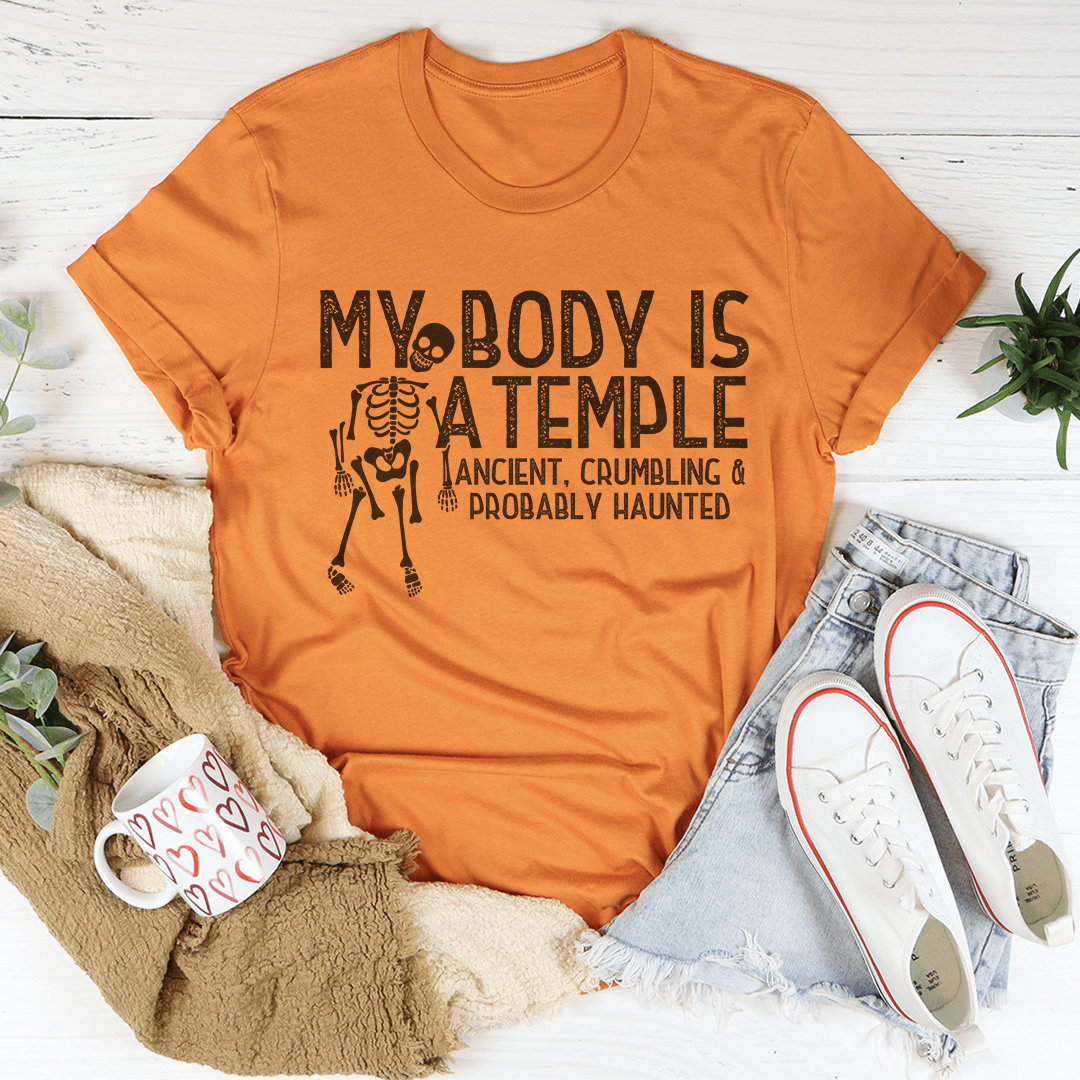 Orange Halloween graphic T-shirt with skeleton temple text design