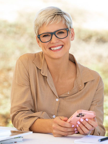 Blue rectangular blue-light reading glasses on a person