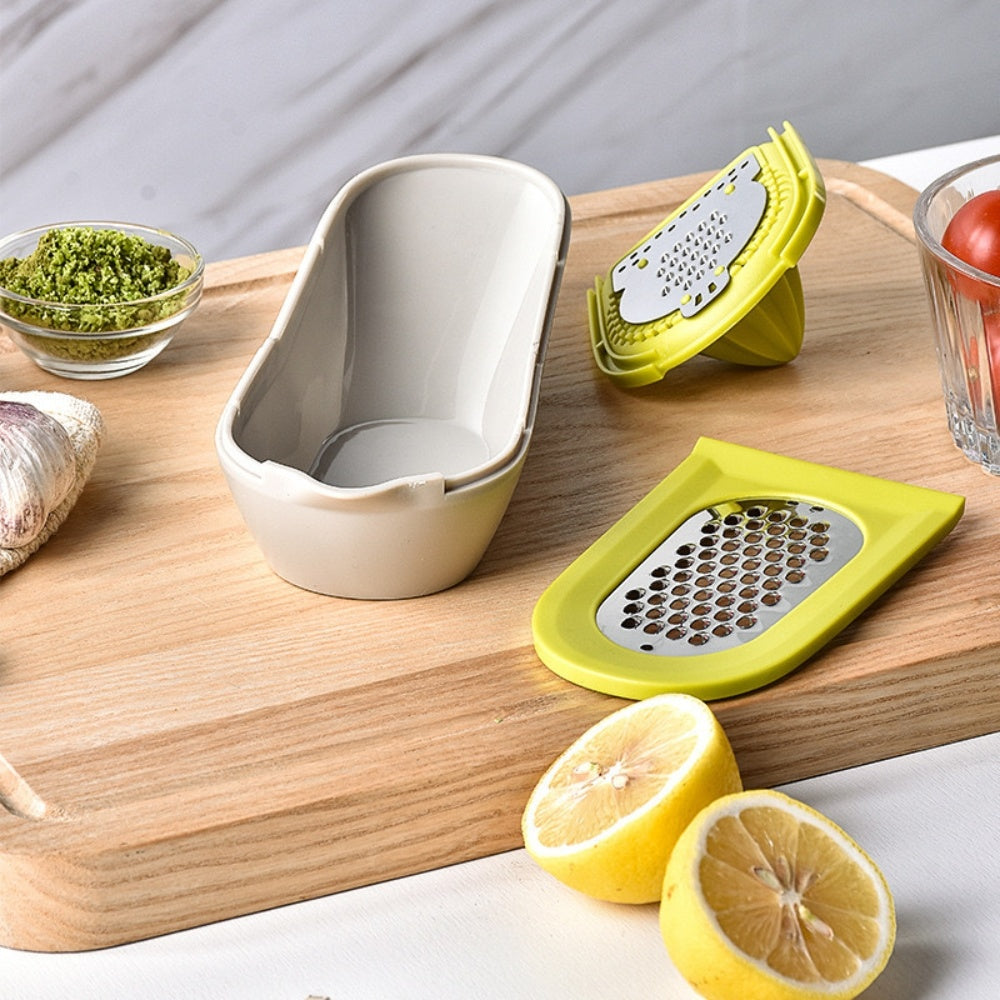 Green citrus juicer with detachable grater, open container, and cone reamer