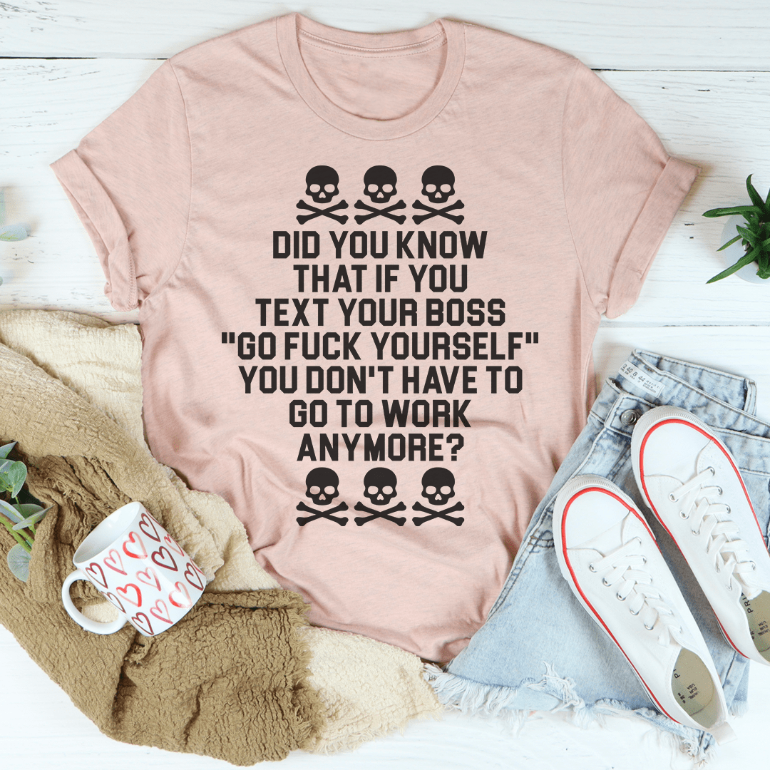 Heathered light pink graphic T-shirt with black skull trio and bold stacked lettering